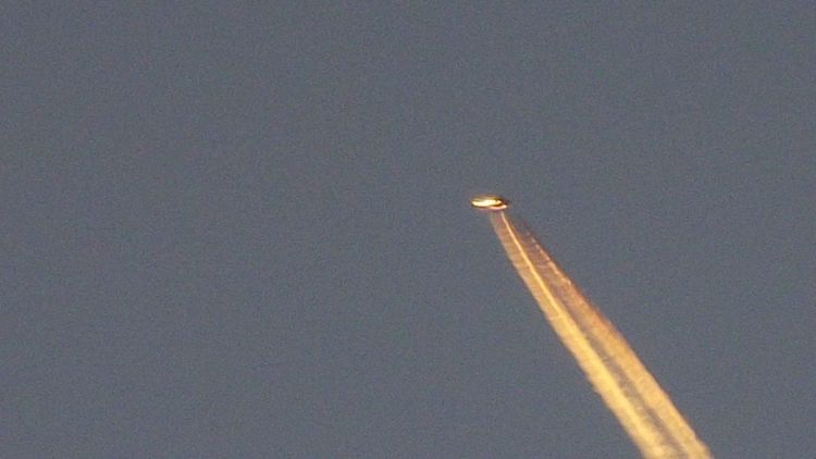 Tyron Osbourne, 52, from Exmouth, Devon, spotted a mystery object above the Devon town, from his garden.  See SWNS story SWUFO; Tyron Osborne, 52, of Brixington, was sitting at home on a day off work when he saw what appeared to be a shooting star. This prompted him to grab his camera and tripod and capture the moment that possibly saw an alien flyover. Dominoes Pizza worker Tyron admitted he was a UFO sceptic until the moment he saw what appears to be a flying saucer travelling towards Lympstone.  He said: “I noticed a star on the horizon and as soon as the sun went down the star started moving at a pace.