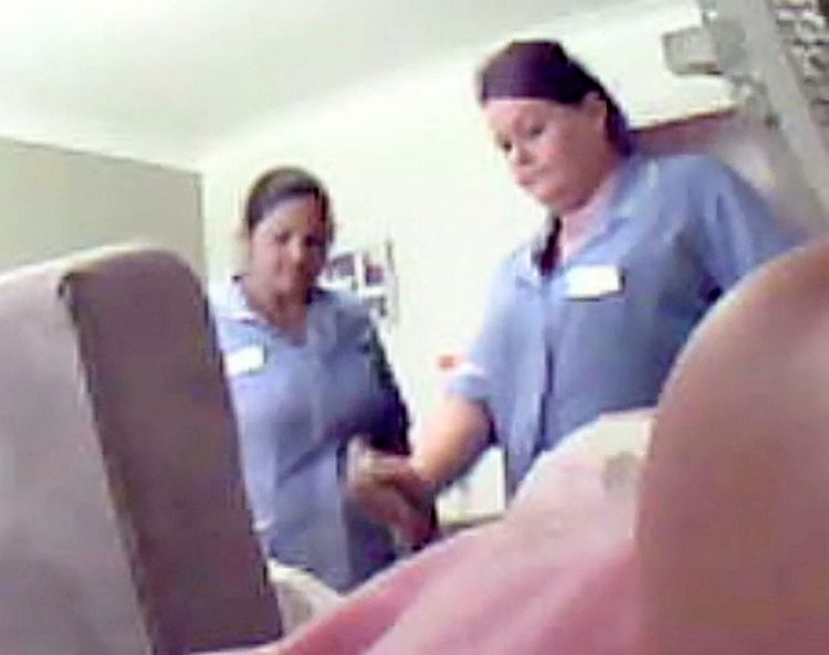 Video grab of a carer Susan Draper captured on film appearing to spray deodorant in Betty Boylan's face and joking it is "better than poo" when a colleague said it went in her mouth. Carer Susan Draper is appearing at Birmingham Magistrates Court today, July 10, 2017. See NTI story NTIABUSE. Betty Boylan's relatives hid the device inside a television after they found unexplained bruising on the retired nurse when they visited her at the £1,000-a-month care home. Within days they uncovered disturbing footage of carer Bina Begum, 49, lifting the great-gran by her head before throwing her back into her chair. The force of Begum's attack was so hard Betty's chair was seen to rock backwards before her head slumped to the side. On another occassion, another carer was caught on film spraying deodorant in Betty's face and joking it is "better than poo" when a colleague said it went in her mouth. Betty's relatives went to the police after recording the footage at the Bupa-run Perry Locks Care Home in Birmingham in September last year.