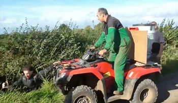 This is the shocking moment a farmer was caught on camera driving a quad bike at a group of fox hunt demonstrators. See NTI story NTIHUNT. Footage released by West Midlands Hunt Saboteurs shows an altercation between a member of Atherstone Hunt and a group of protestors filming the hunt on their mobile phones. The farmer, dressed in John Deere overalls, drives a quad bike up to three men and shouts at them to get off his land. He then pushes one into a ditch and begins attacking whoever he can reach in the three-and-a-half minute video. He confronts the demonstrators and tries to prevent them filming him before knocking another to the ground. He continues to drive at the protestors with his quad bike, telling them, You are on private property, I can do what I want. The dramatic footage filmed on Saturday (14/10) in Ratcliffe Culey, Leics., captures the moment the farmer drives another person into a ditch and can be heard saying, Thats one more, does anybody else want some?