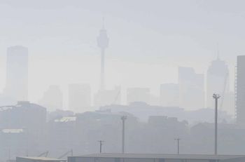 Smoke haze covers Sydney as wildfires burn near the city (Rick Rycroft/AP)
