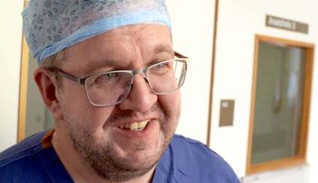photo of Vascular surgeon Neil Hopper, 43, who had a below-the-knee double amputation after falling ill with sepsis.