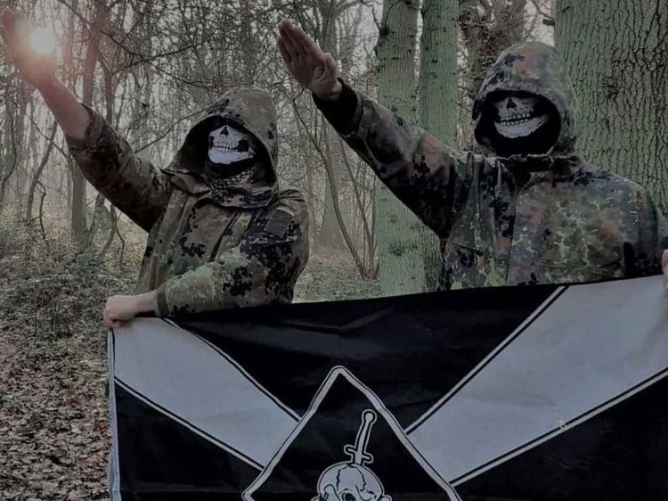 Two members of Feuerkrieg Division, not including the defendant, posing in a photo posted in an online chat
(Eugene Antifa)